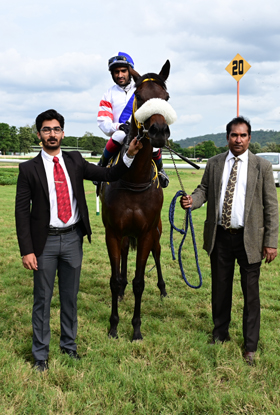 Perfect Empress (Kiran Rai P up) winner of the Hotel R R R Trophy, being led in by trainer Girinath C on Thursday races at Mysore.